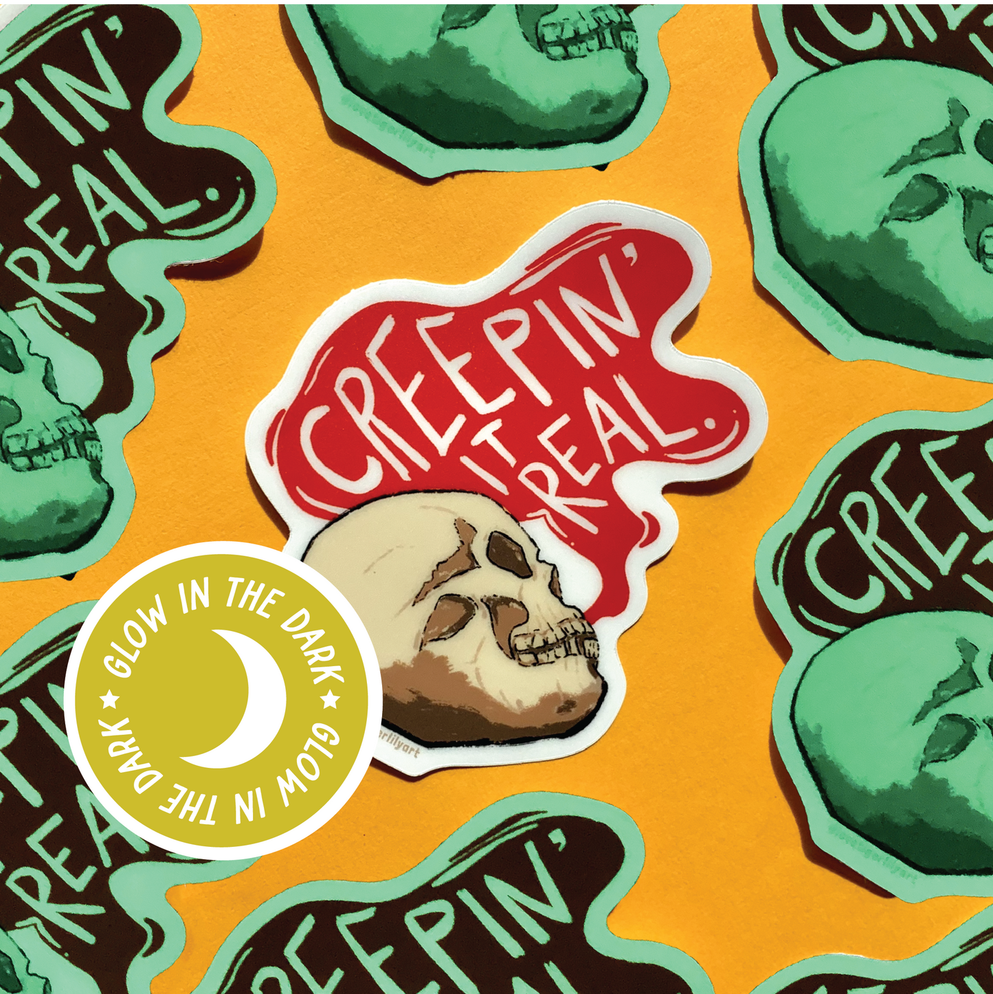 Multiple of the Glow in the Dark Creepin It Real sticker of an illustrated skull saying “Creepin It Real”