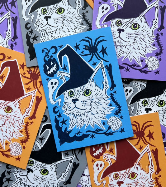 Collection of Halloween-themed cat illustration greeting cards on colorful backgrounds