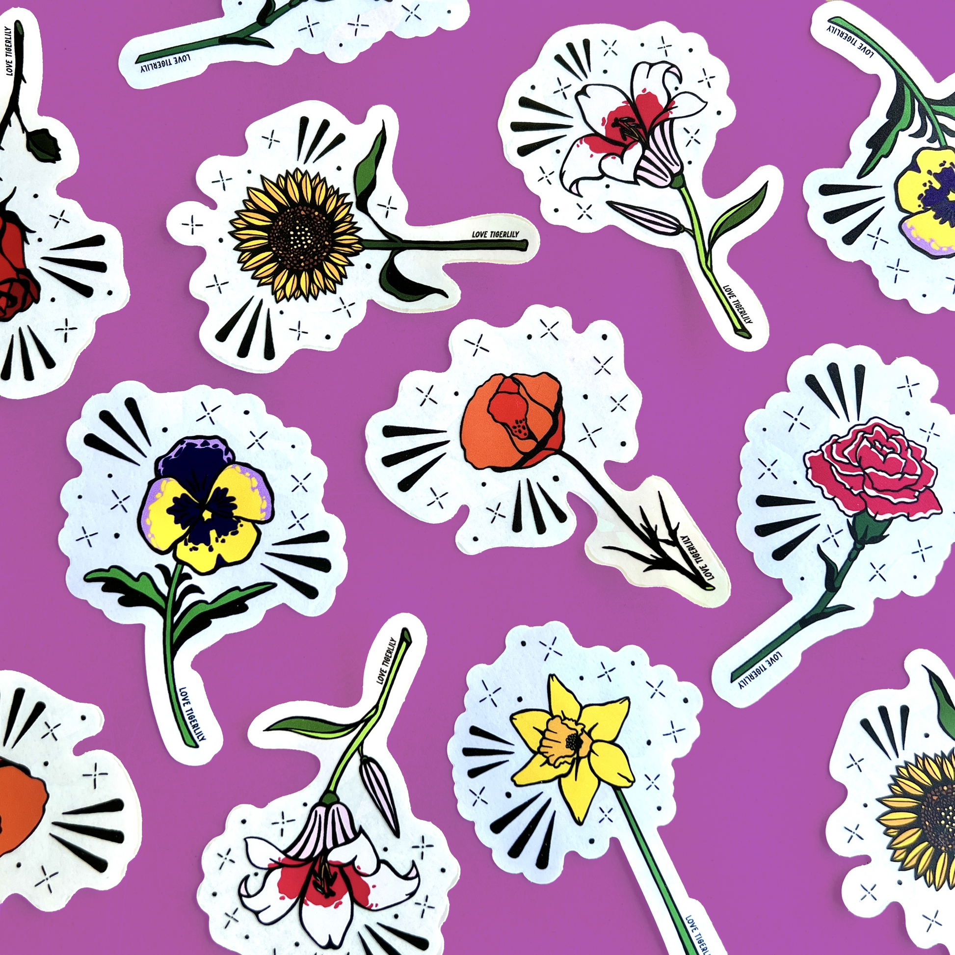 Photo showcasing multiple floral suncatcher stickers (Poppy, Rose, Lily, Pansy, Carnation, and Sunflower) over a purple background.